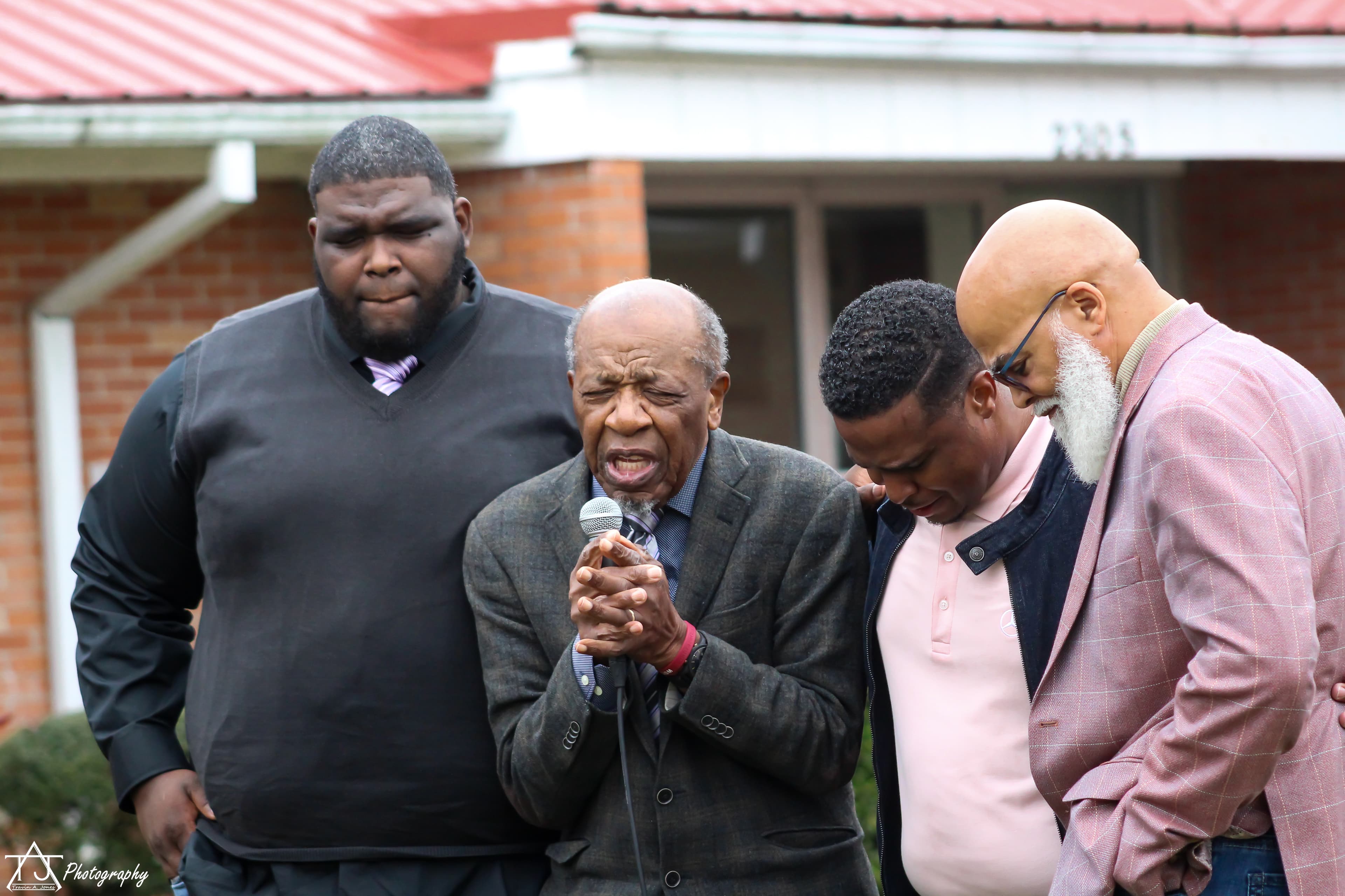 Men praying together at a men's ministry gathering